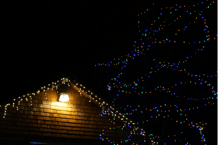 Christmas lights installed along the edges of the roof of a home in Logan Utah.